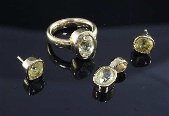 An 18ct gold and yellow sapphire set suite of jewellery, ring size H.